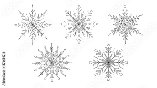 Collection of five unique and intricate black snowflake designs with delicate geometric patterns isolated on white background.