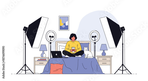 Female blogger or content creator sitting on her bed with a laptop and a cat, in a home studio setup with professional lighting equipment.