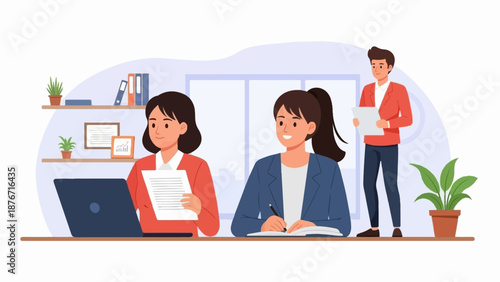 Three people working in an office, one on a laptop, one writing, and one standing with papers