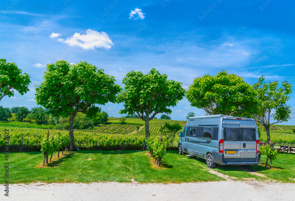 Fototapeta premium Campervan Motorhome Parked by French Vineyard on a Sunny Summer Day