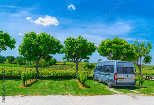Campervan Motorhome Parked by French Vineyard on a Sunny Summer Day