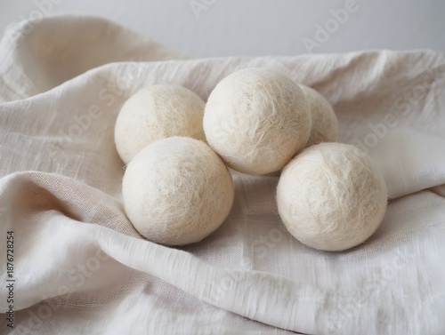 White wool dryer balls on soft cloth