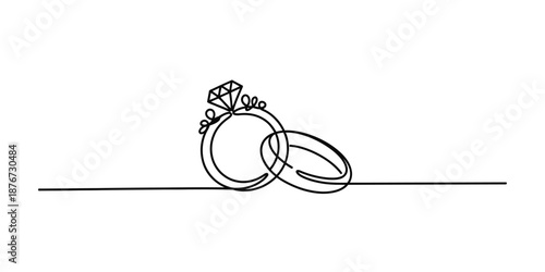 Elegant continuous line art of wedding and engagement rings with a sparkling diamond
