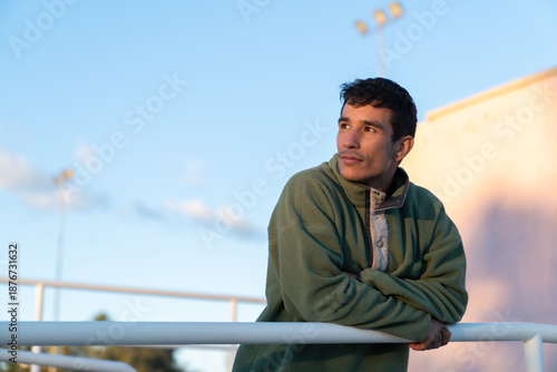 Photos Young adult man looking away, contemplating future outdoors