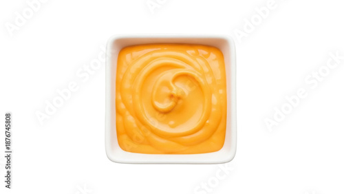Foto Creamy cheese sauce in square bowl isolated PNG, delicious cheddar dip for nacho