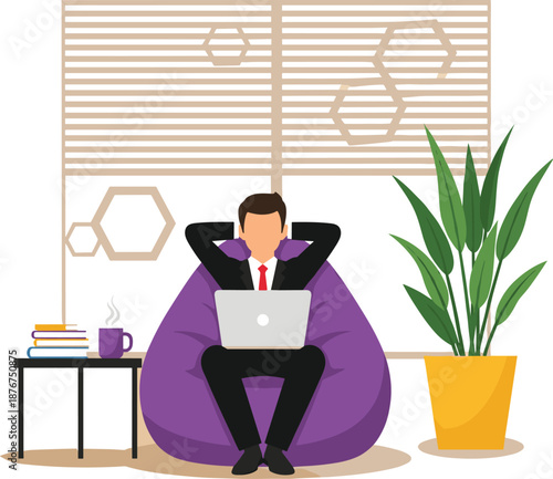 Businessman working on laptop while relaxing in bean bag chair at home office for freelance and remote work.
