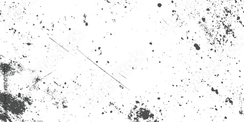 Dense grunge texture with clusters of dark gray splatters and diagonal scratches on a white background