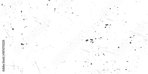 Scattered grunge texture with small dark gray dots and thin diagonal scratches across a white surface