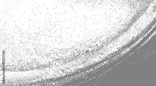 Abstract grunge texture with a curved band of gray dots and scattered particles on a white background, distressed