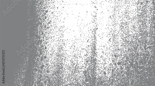 Grungy abstract background in gray and white with a heavy speckled texture and scattered distressed creating a chaotic and weathered appearance