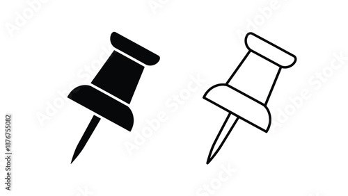 black and white push pins on a plain background