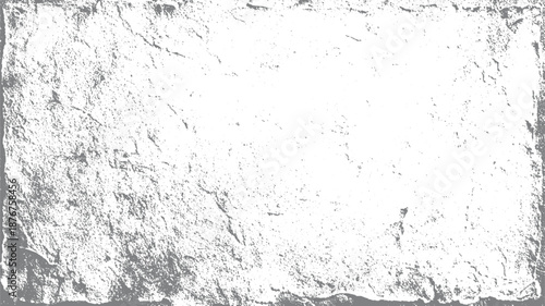 Rough stone texture with a weathered irregular border and granular surface details in grayscale creating a natural and aged abstract background