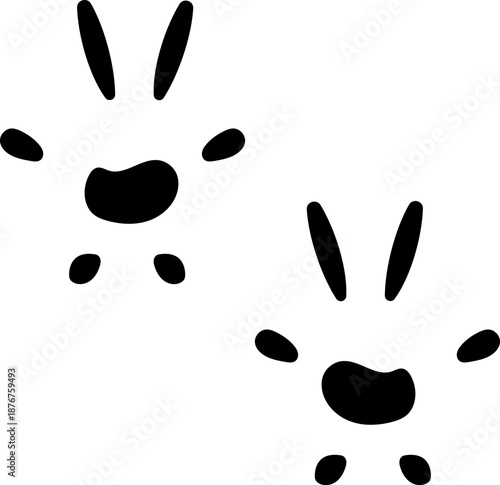 Rabbit paw prints leaving tracks on white surface