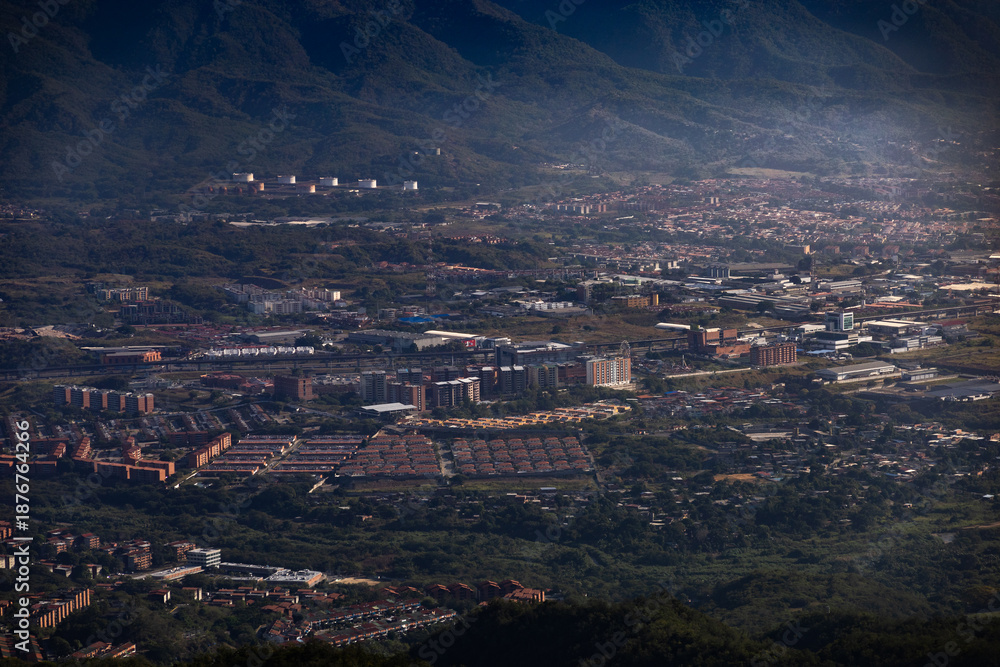 Obraz premium Urban landscape of the Guarenas and Guatire valley in front of the Waraira Repano National Park (El Ávila)