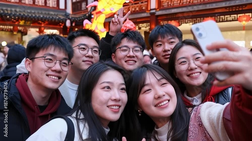 Group of young people taking a selfie at a festive lantern fair
