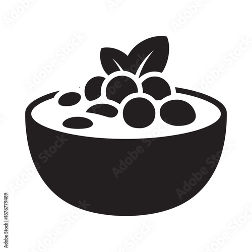 a bowl of oatmeal with fruit and leaves on top