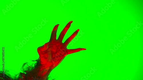 scary hand with claws wolf werewolf monster paw on a green background