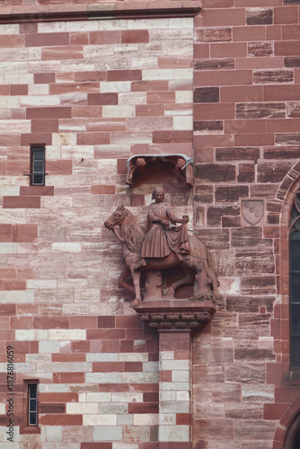 Sculpture of Martin, patron saint of knights, on wall on cathedral. Basel, Switzerland