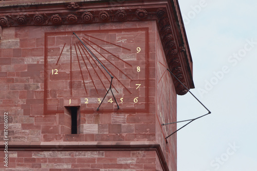 Sundial on cathedral tower. Basel, Switzerland