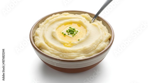 Mashed potatoes in a bowl with butter and herbs