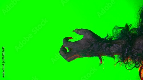 scary hand with claws wolf werewolf monster paw on a green background