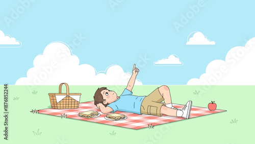 Boy Lying on Picnic Blanket Pointing Skyward Enjoying Relaxing Summer Day