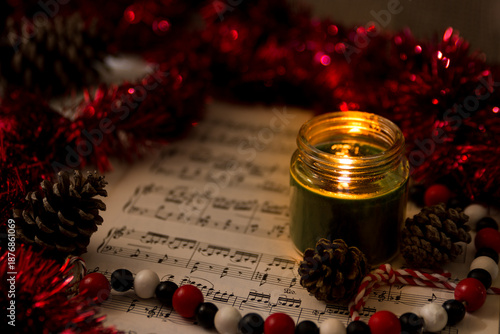 christmas still life with red garland sheet music
