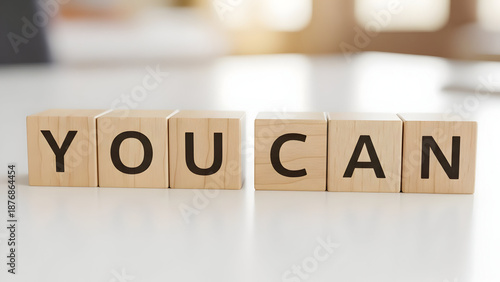 wooden blocks spelling “YOU CAN”, empowerment message