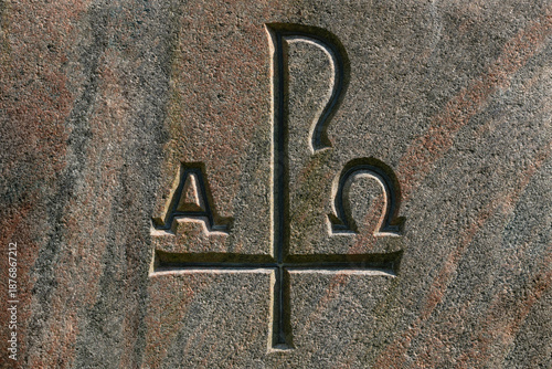 Chi Rho, Charisma or Chrismon. Monogram of the name of Christ. I am Alfa and Omega. Biblical lettering. Sacred symbol of the Christian religion. Granite background.