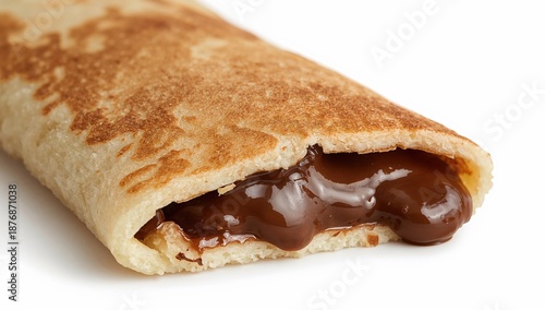 Folded pancake with gooey chocolate sauce oozing from inside and along the edges on a white background