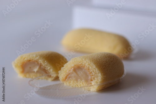 Japanese banana cream sponge cake with soft texture, photographed close up on a clean white background