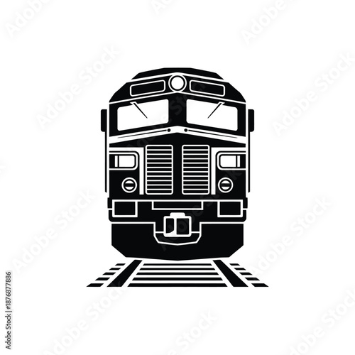 Front view of a black and white locomotive on train tracks