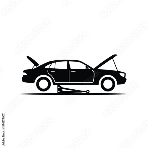 car on a lift with hood and trunk open