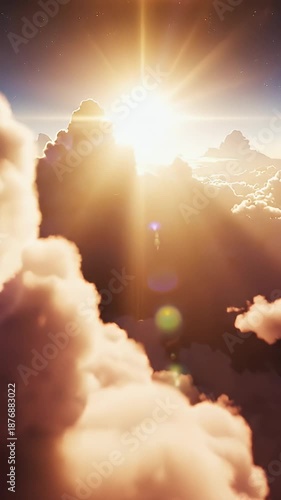 Heavenly Clouds and Sunlight - This video shows a view from above the clouds, with sunlight streaming through the fluffy formations. The light creates a warm and ethereal atmosphere.