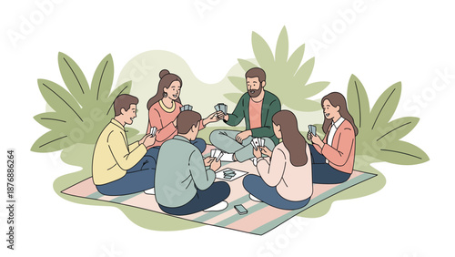 Group Of Friends Enjoying A Card Game Picnic Outdoors Together In Summer