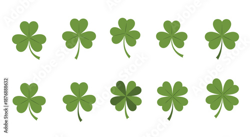 Collection of green three-leaf clovers and a single lucky four-leaf clover for Saint Patrick's Day celebrations.
