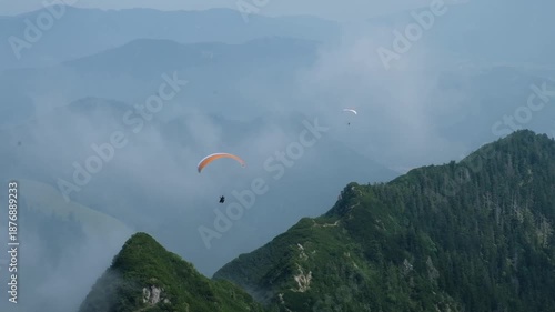 Paragliders in the mountains of the Alps