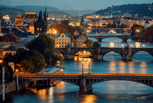 Sticker Cityscape At Dusk With Glowing River Bridges, Warm Streetlights Shine On Peacefu