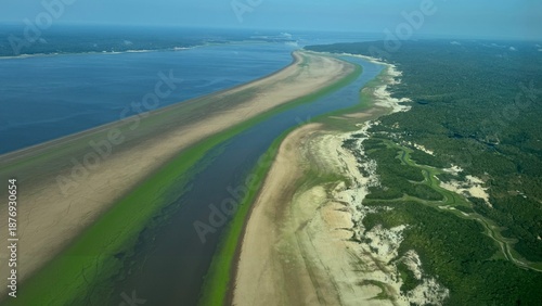 Aerial view of the Amazon River basin affected by historic drought in 2024, showing extremely low water levels along the Rio Negro in the state of Amazonas, Brazil. Exposed riverbanks and reduced wate