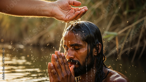 Man praying receiving holy water anointing during Christian baptism ceremony in River Jordan, a biblical scene recreation for spiritual renewal, religious publications, and faith journey imagery