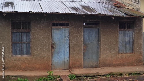 Door and window seen from a hallway in the morning in Africa, a morning in Uganda