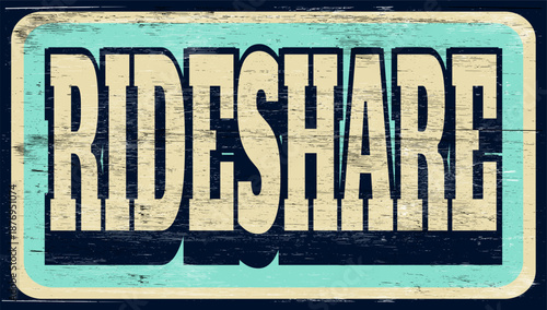 Aged and worn rideshare sign on wood
