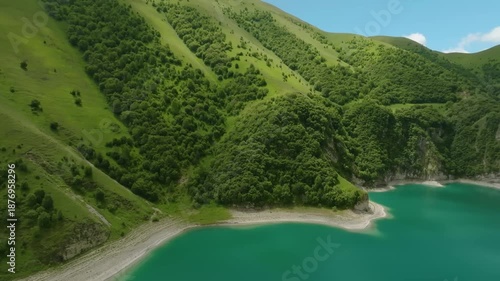 Drone footage capturing the stunning natural beauty of Lake Kezenoyam, the largest and deepest high-altitude lake in the Caucasus Mountains, located on the border of the Chechen Republic and Dagestan,