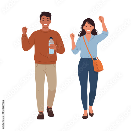 Smiling man and woman celebrating with raised fists