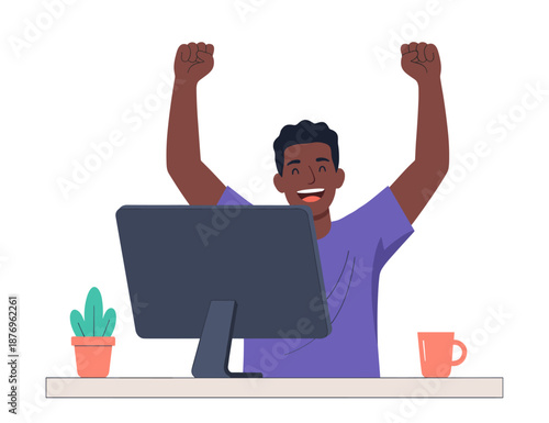 Man celebrating success at computer with raised fists