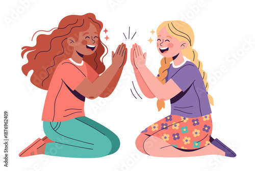 Girls high-fiving in joyful celebration