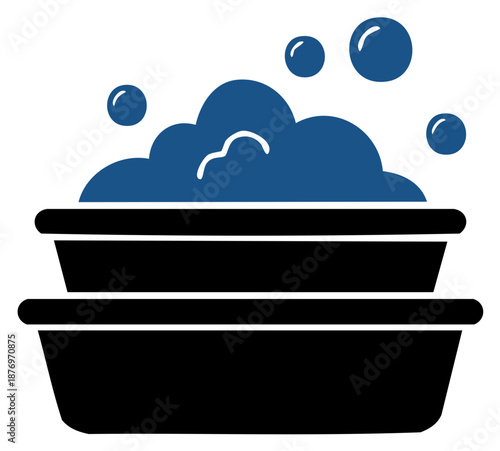 Stack of basins filled with blue suds and bubbles for washing clothes