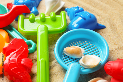Wallpaper Mural Bright children's beach toys and seashells on sand, closeup Torontodigital.ca