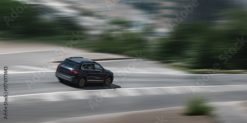 A moving car. A fast moving car on a speed blurred background