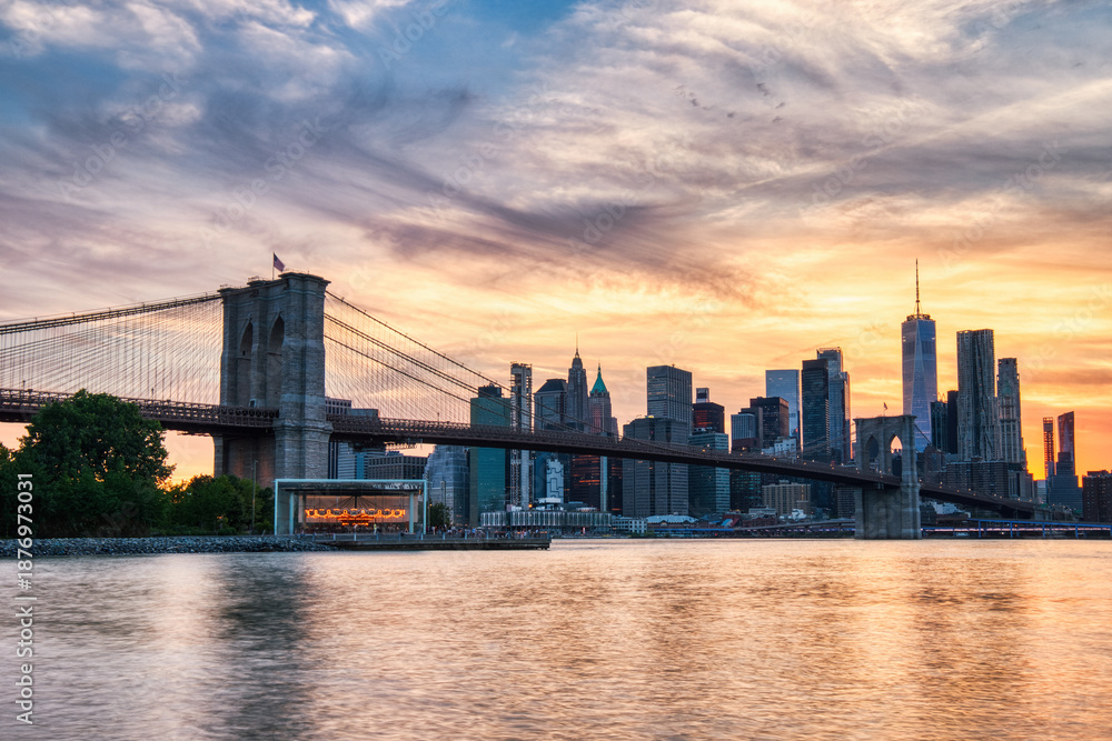 Fototapeta premium New York City Manhattan Downtown with Brooklyn Bridge at Sunset